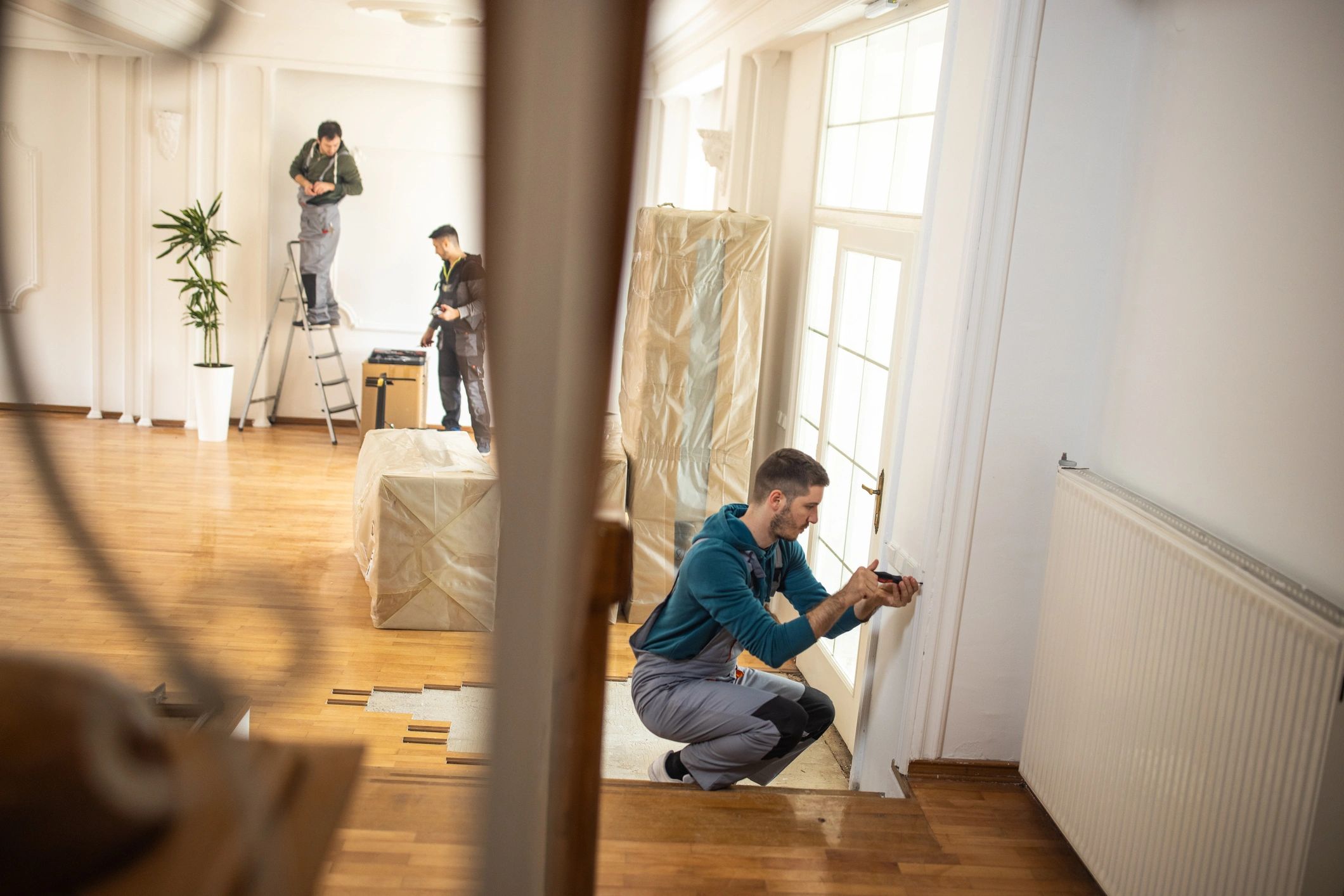 Repairman team working together in client's house