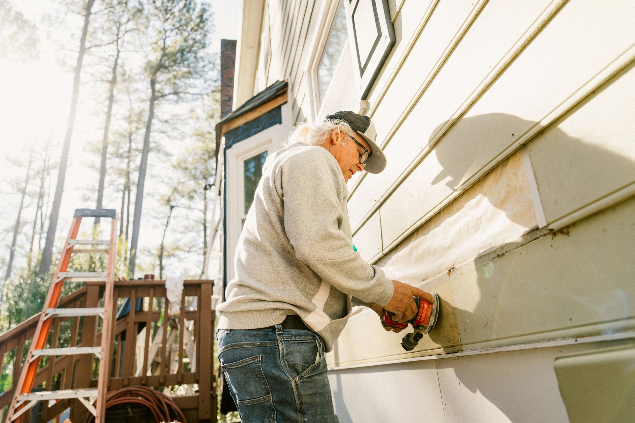 Professional painter working on a home's exterior